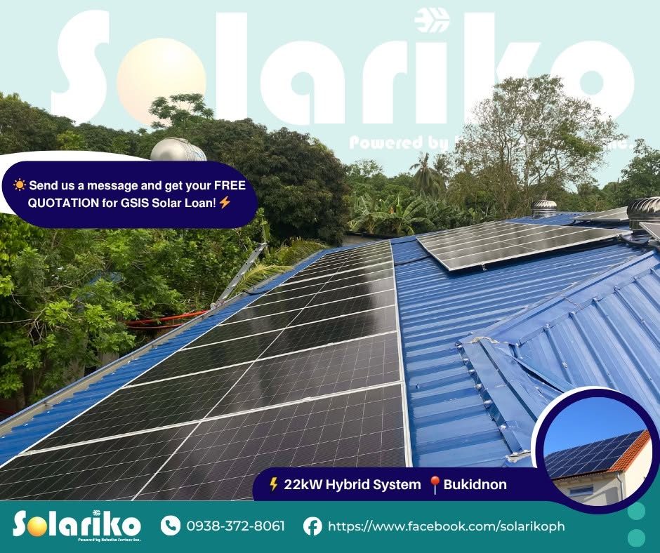 Solar panels installed on the blue metal roof at Almans Farm