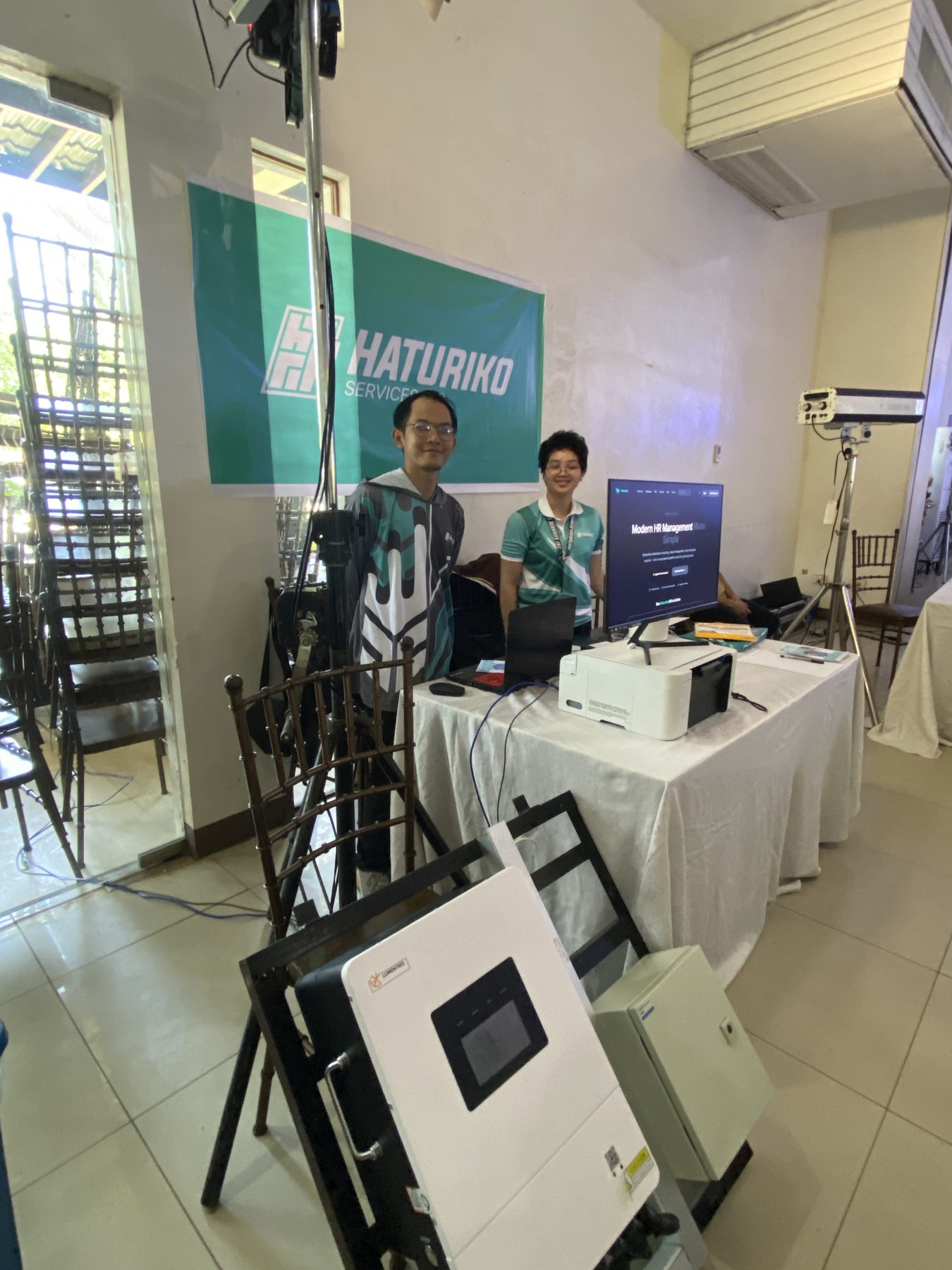 Haturiko team setting up equipment at the PMAP event venue