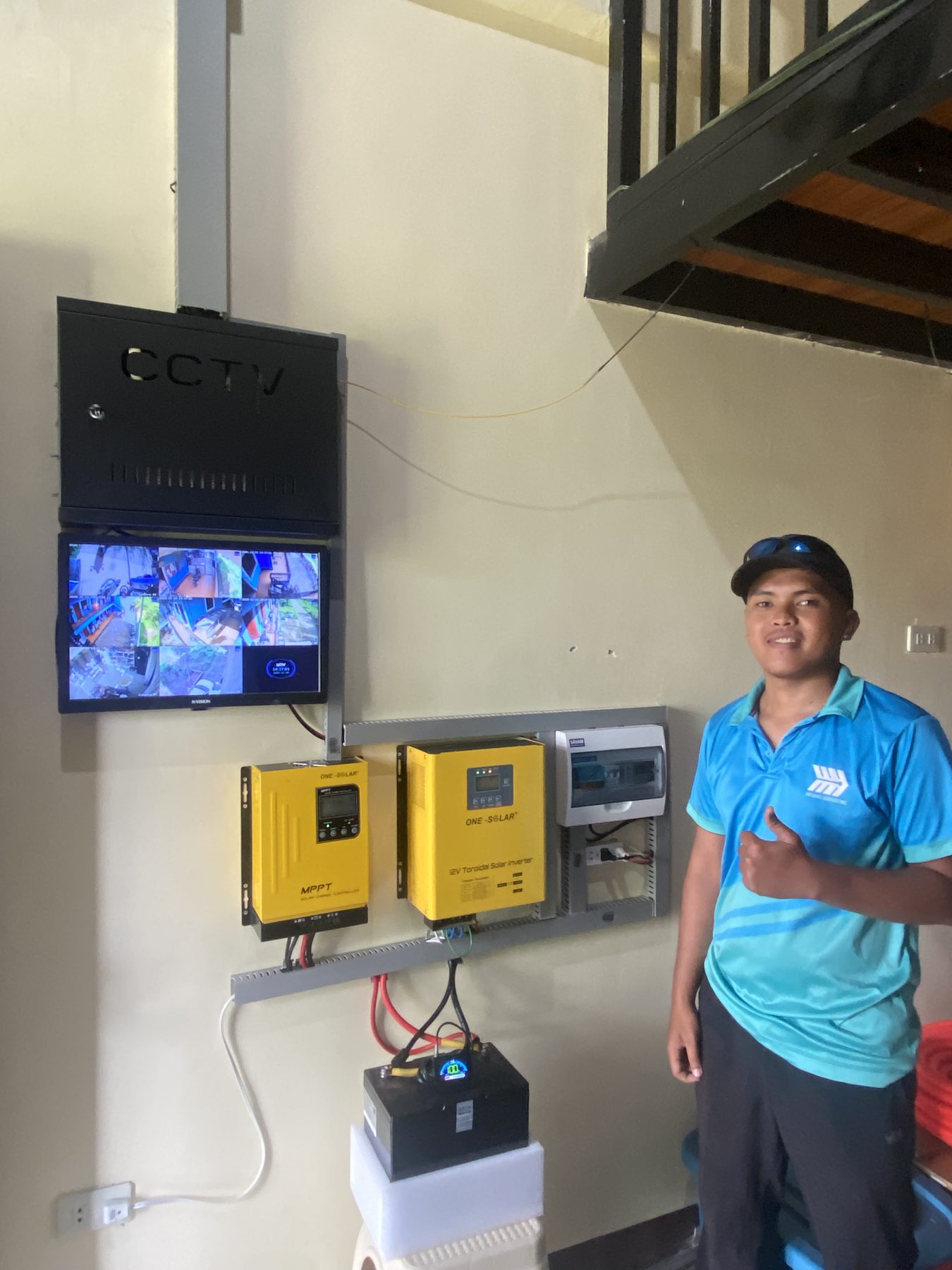 Small solar inverter setup with CCTV monitor on the wall